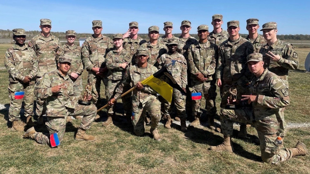 Three rows of KU Army ROTC cadets seated and standing in group photo.