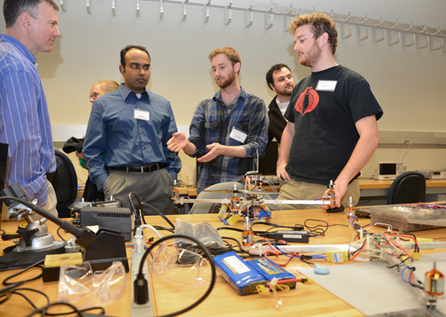 Garmin engineers talk with Computer Engineering seniors about their project.