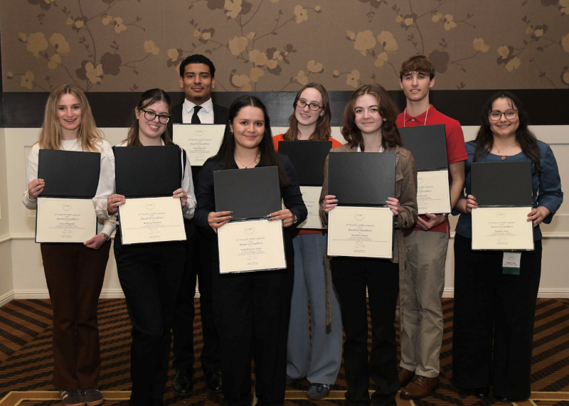 Eight Students show off awards