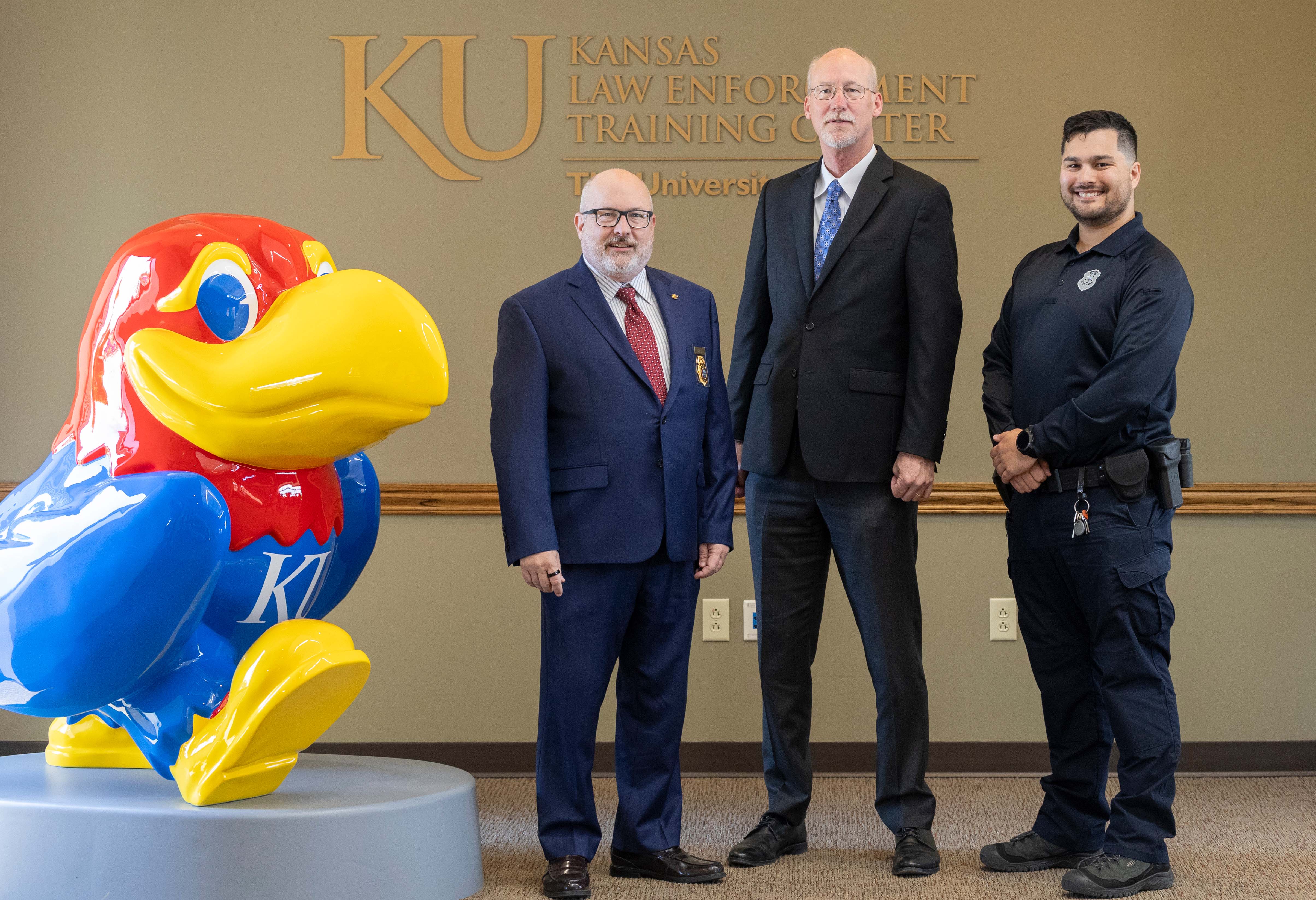 Vice Provost and Director of Police Training Darin Beck, Blake Flanders, president and CEO of the Kansas Board of Regents, Devin Sun.