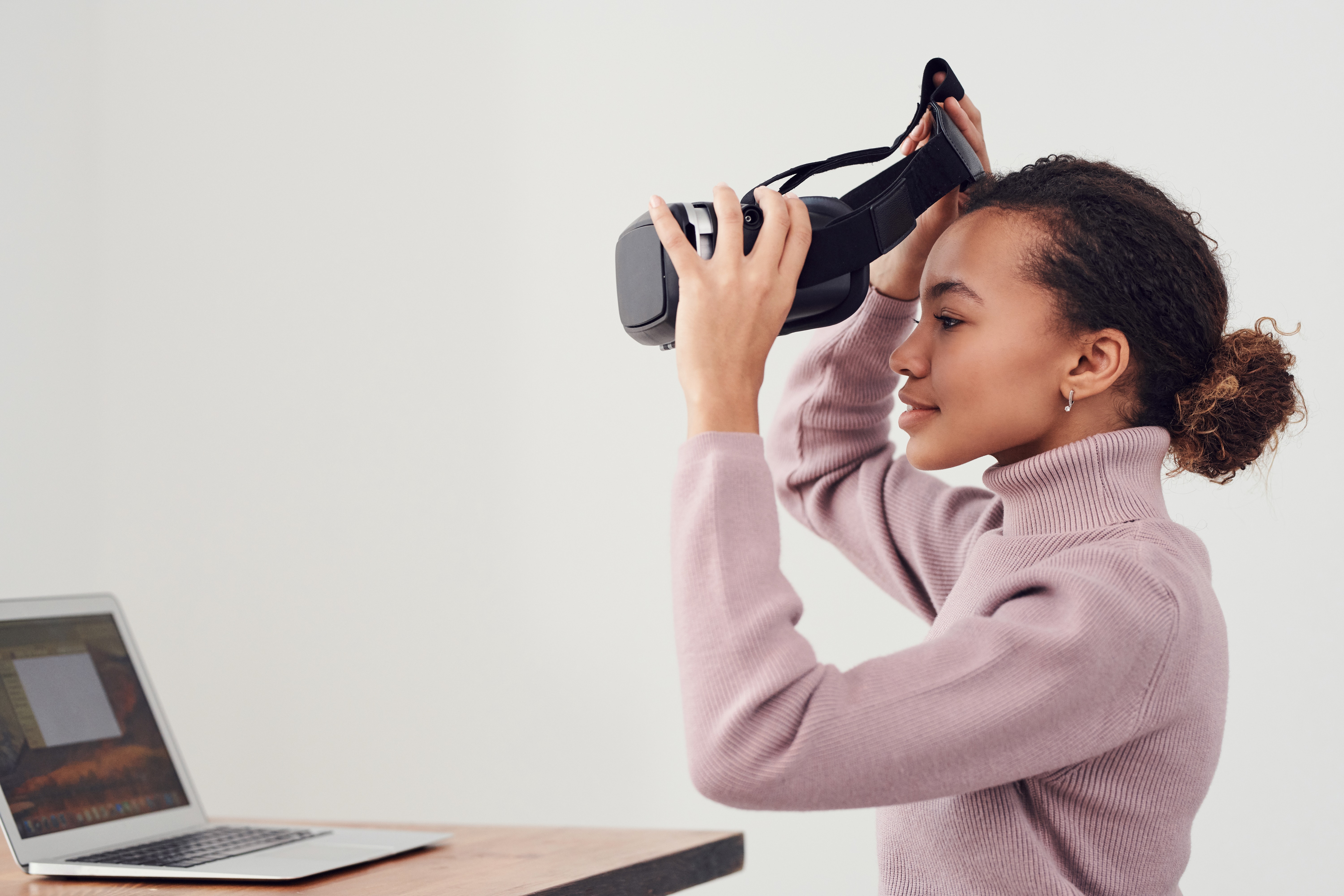 Person putting on augmented reality goggles