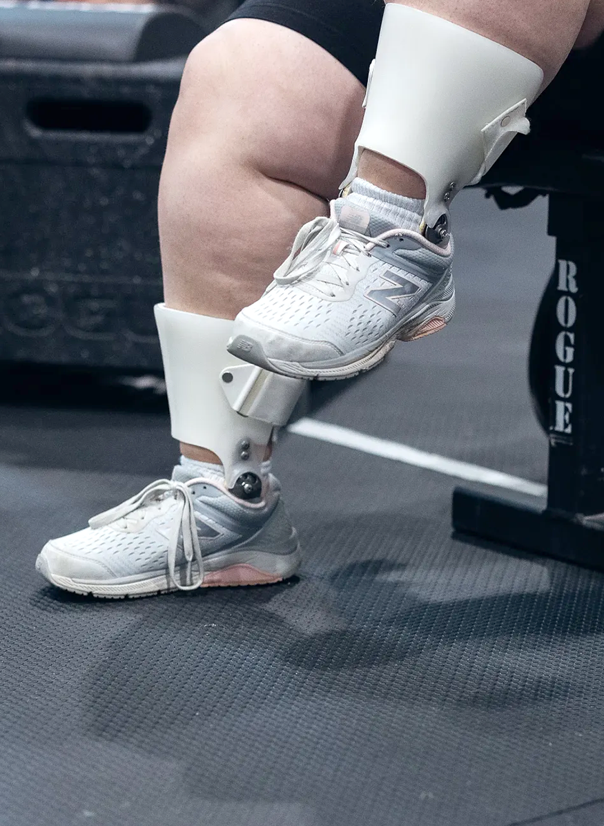 A close up of an athlete's feet which are supported by braces.
