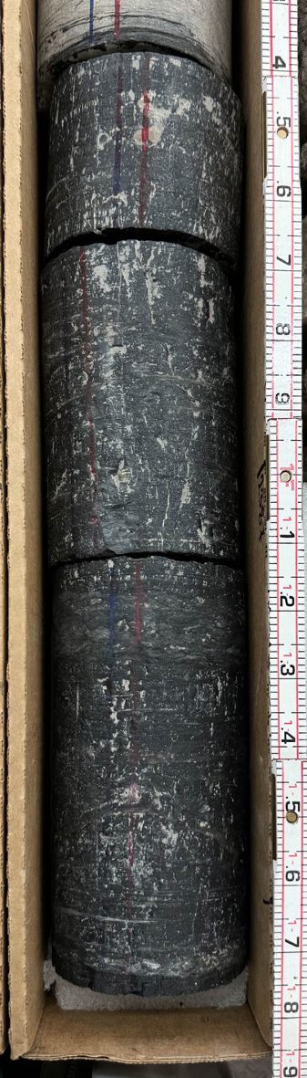 Four-inch diameter core obtained from a coal interval in the Lyon County well. The coal layer is about 1.3 feet thick
