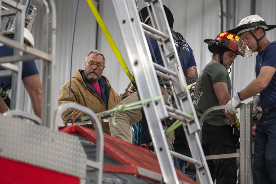 Farmer Joey Berntsen looks into the grain bin on KFRTI's Grain Bin Rescue trailer in Iola, Feb. 21, 2026.