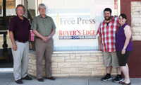 From left, Don Ratzlaff, minority owner and managing editor of the Hillsboro Free Press; Joel Klaassen, former publisher, and Joey and Lindsey Young, new owners and publishers. 