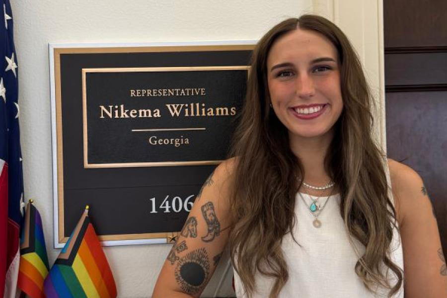 Natalie Miller stands in front of the office of George Congresswoman Nikema Williams