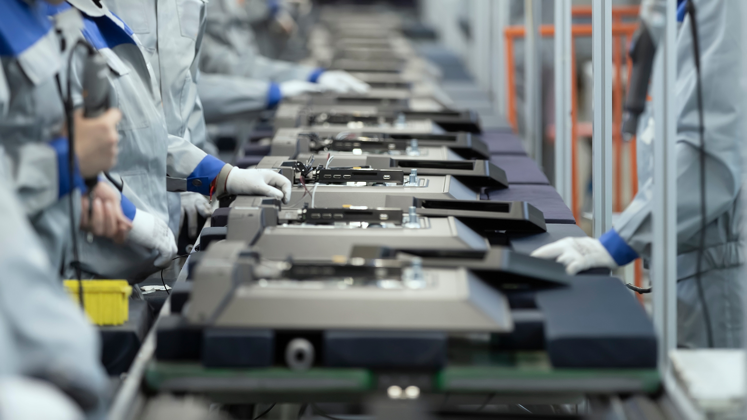 Workers on an assembly line