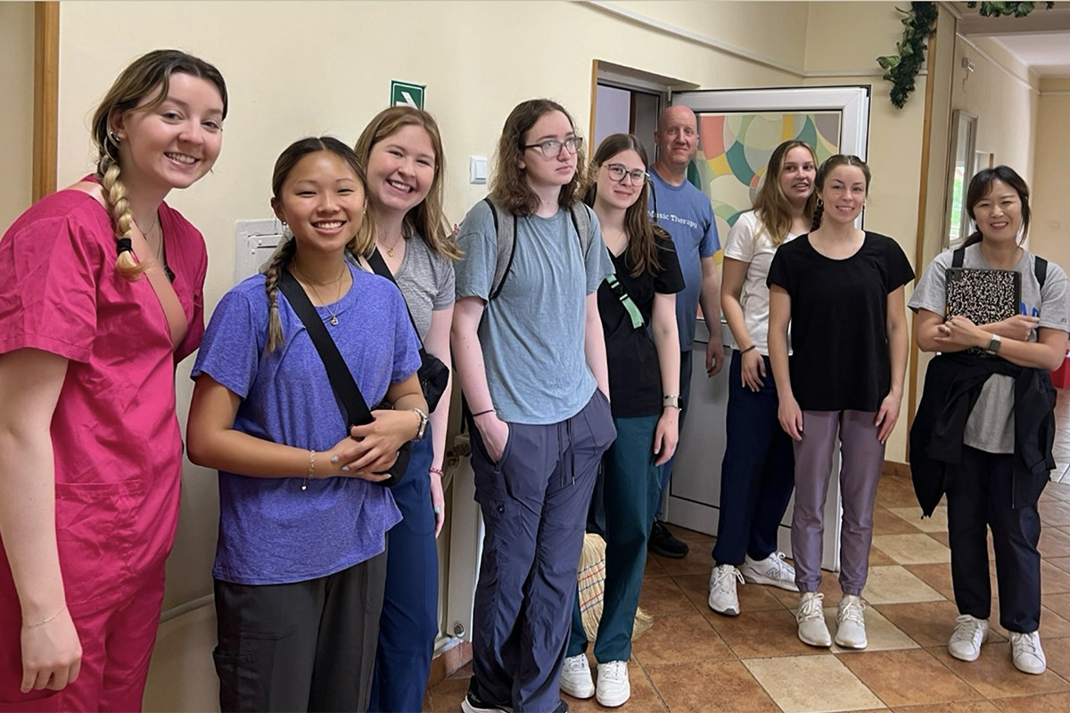 Students and faculty member Bill Matney gather at an elder care home in Stolat, Bulgaria.