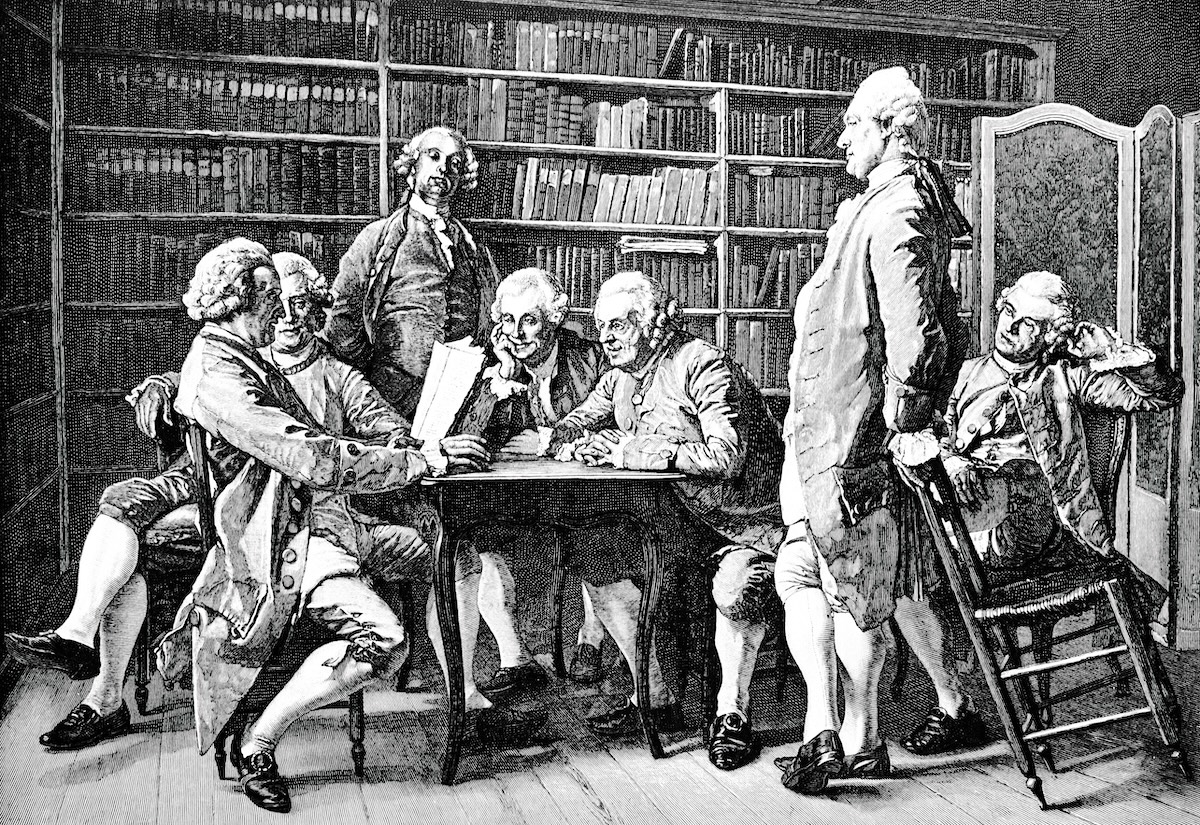 A drawing shows a group of 19th century intellectuals involved in a discussion.