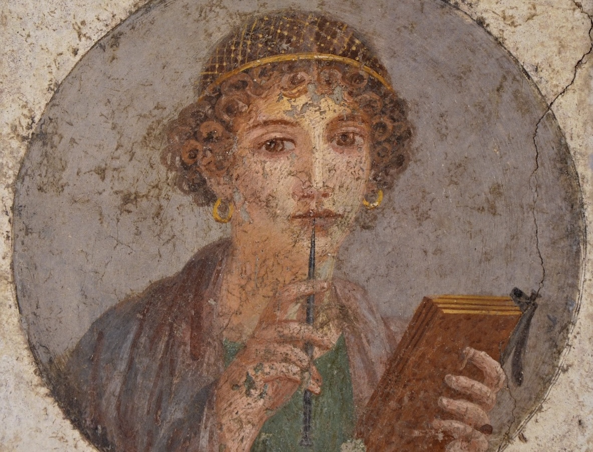 An ancient fresco shows a poet called Sappho holding writing implements.
