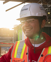 Karsh smiles in his protective gear on the site of the Gateway Project.