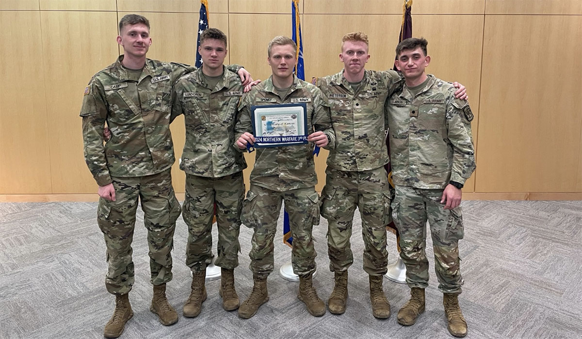 In military fatigues holding certificate are Team A members Braxton Camp, Nate Lundgren, David Spenny, Mason Patterson and Delton Larson.