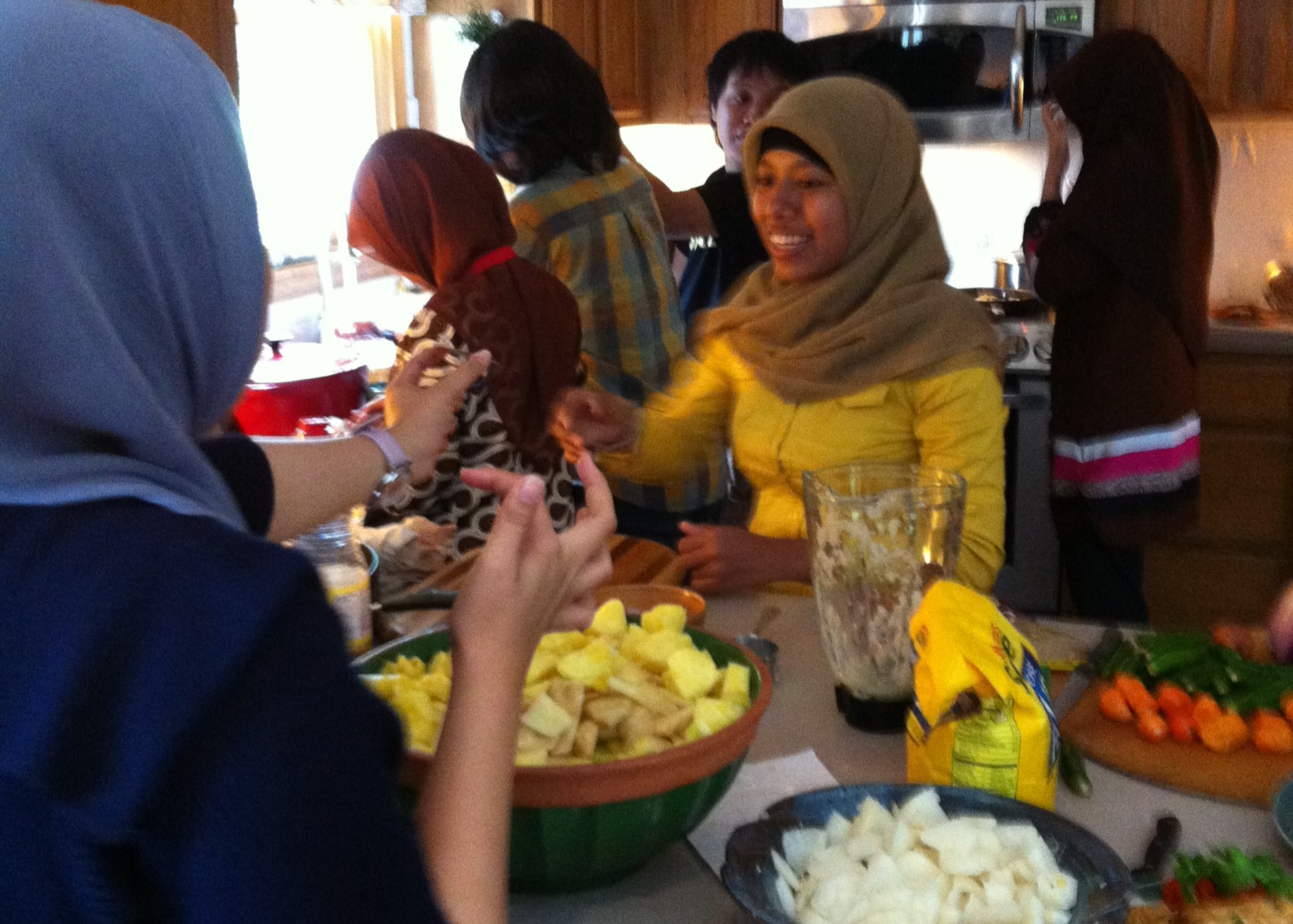 Indonesian participants cooking in a kitchen