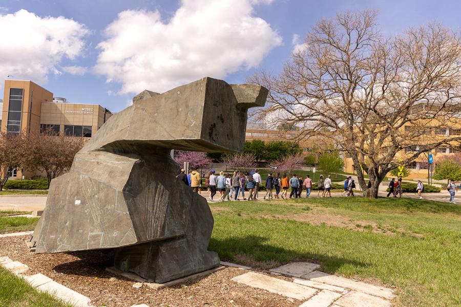 Students walk near Green Hall, home to the KU schools of Law and Social Welfare.