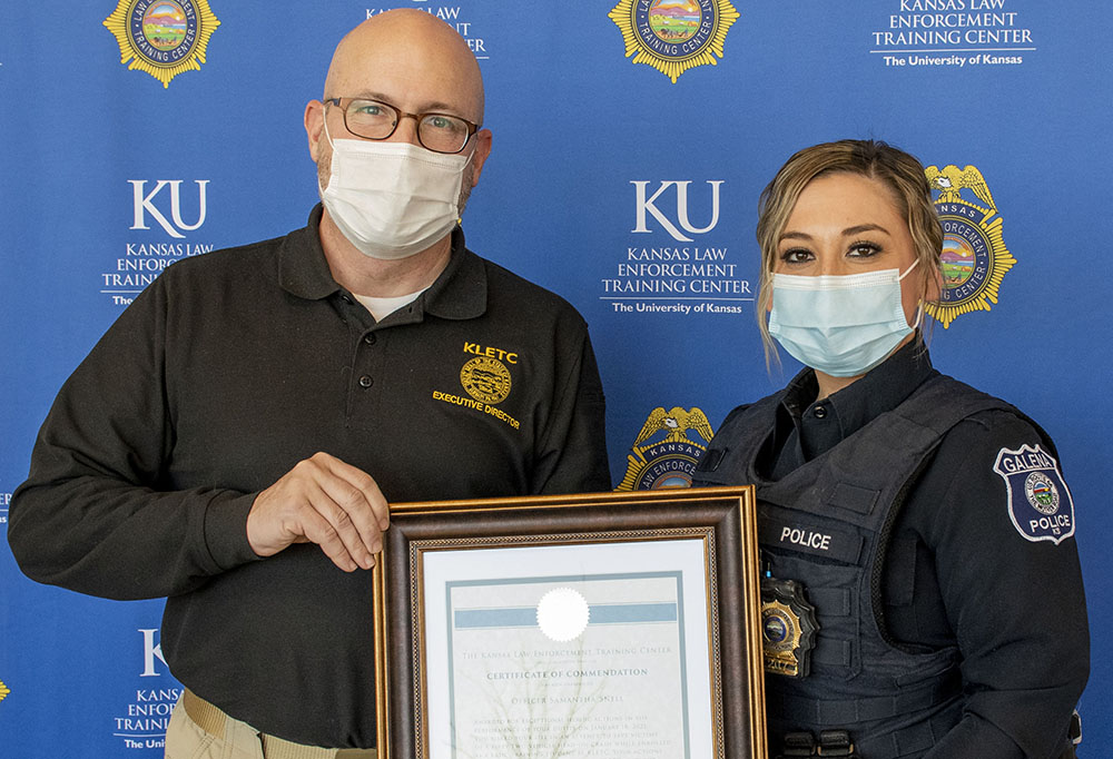 KLETC Executive Director Darin Beck awards Officer Samantha Snell of the Galena Police Department with the KLETC Certificate of Commendation for her actions in the performance of her duties.