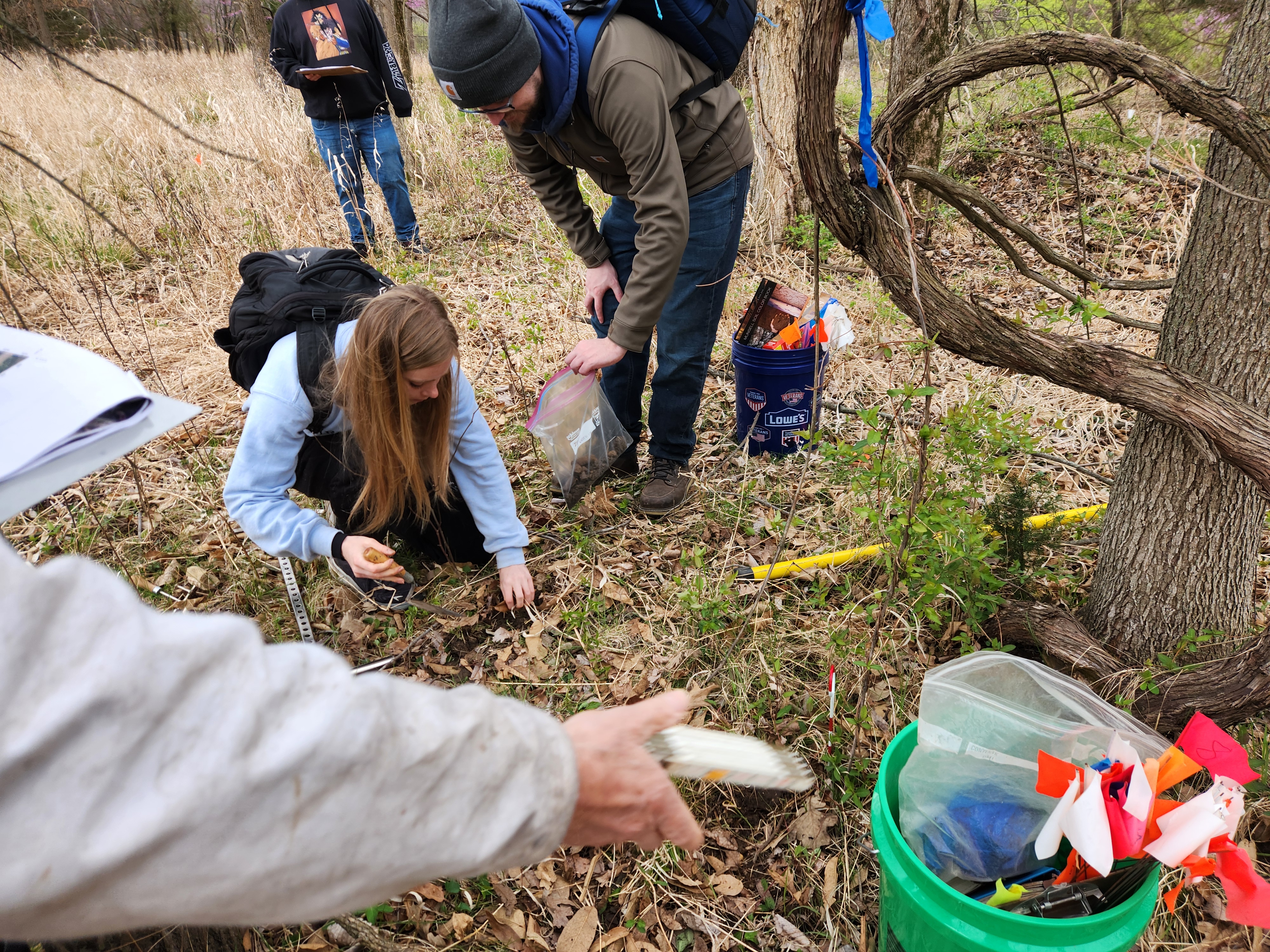 students performing fieldwork int he Kansas winter.