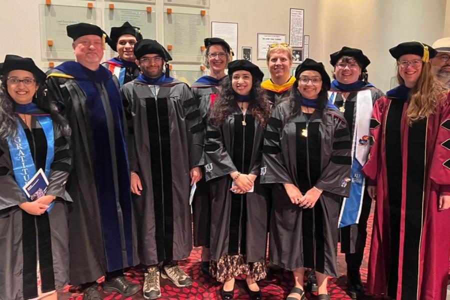 group of PhD graduates and faculty