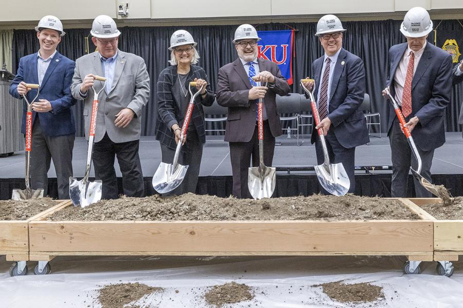 Wearing hard hats and holding shovels at the indoor KLETC expansion groundbreaking include, from left, Kansas Senate Majority Leader Chase Blasi, Kansas Speaker of the House Daniel Hawkins, Provost Barbara A. Bichelmeyer, KLETC Director Darin Beck, Chancellor Douglas A. Girod and Board of Regents member Wint Winter.