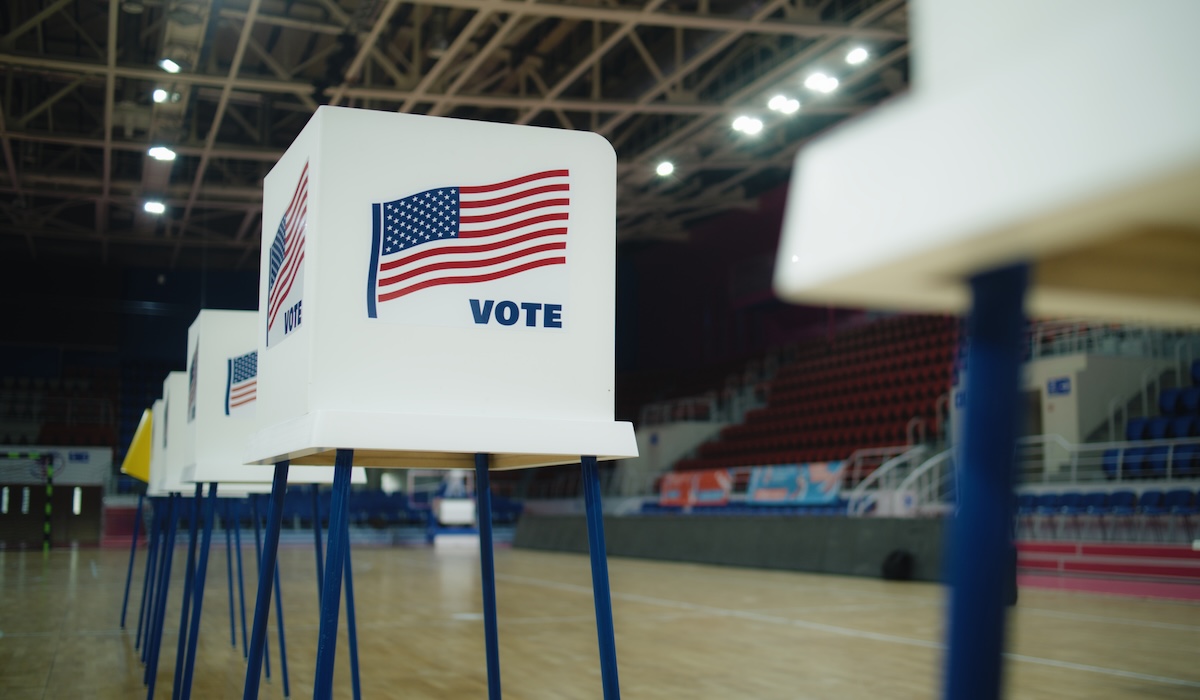 election tables lined up in a gymnasium