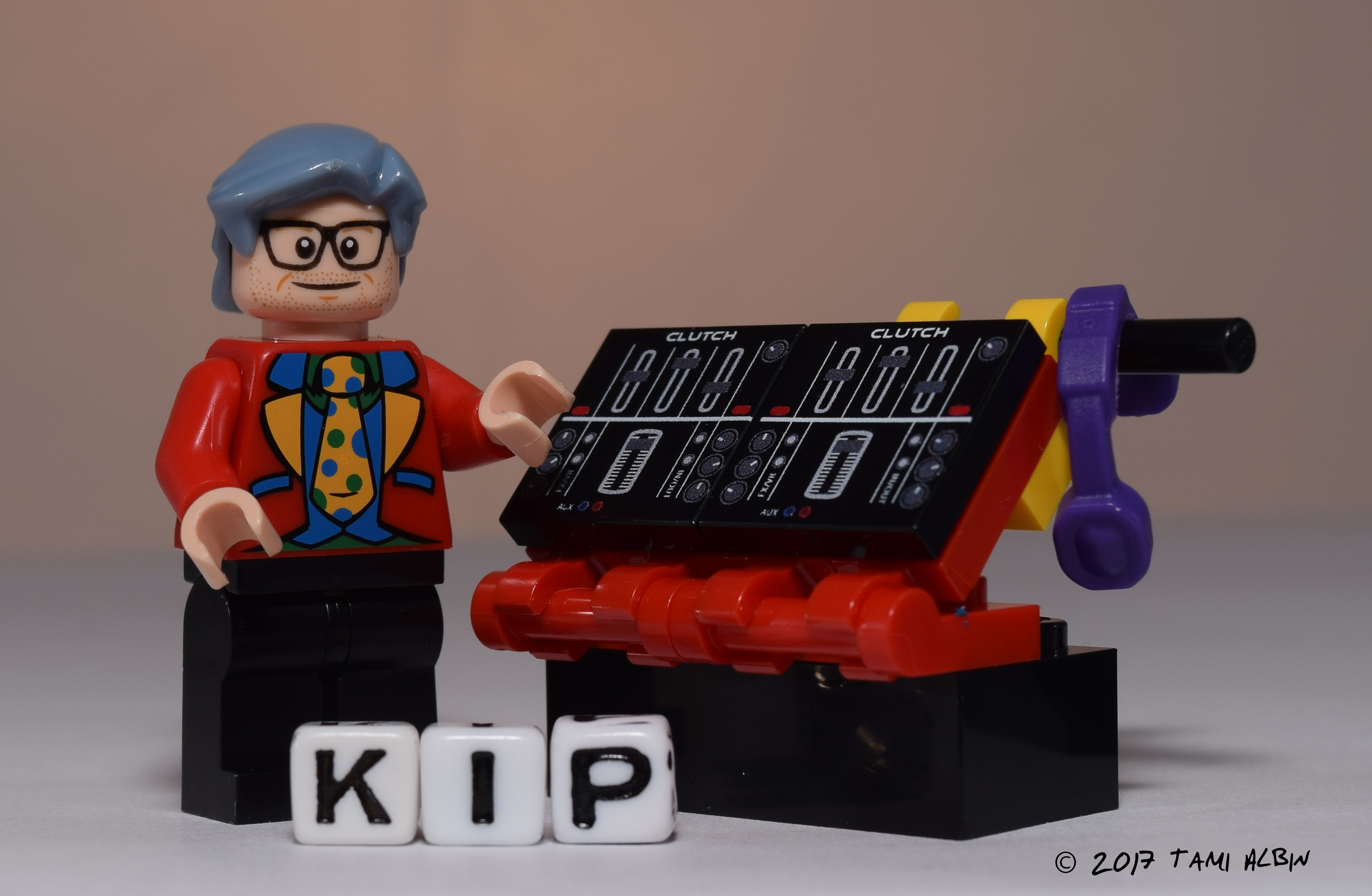 Lego Kip standing next to Lego AUMI