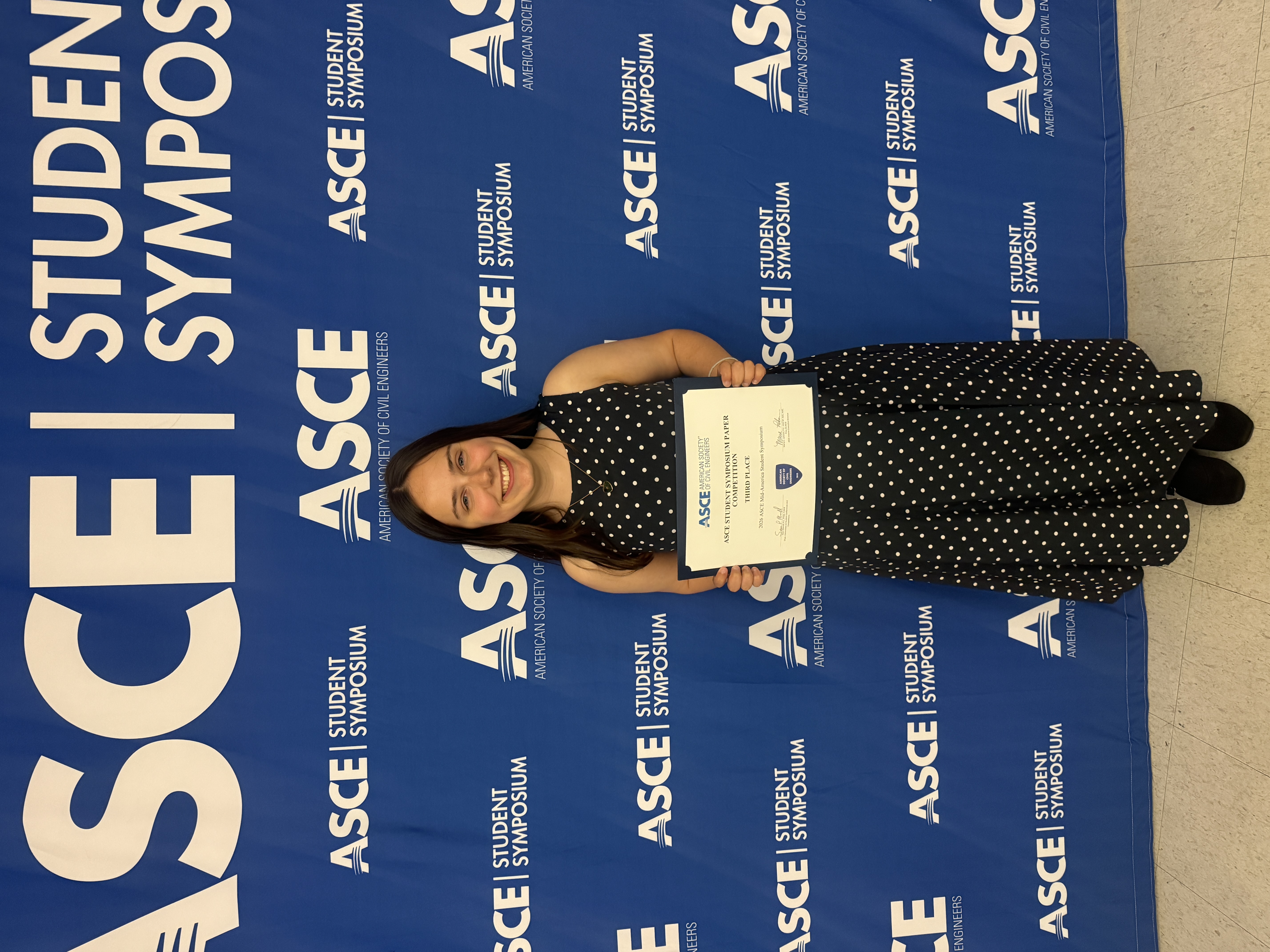 Hannah Poe, senior in civil engineering, with her third place certificate.