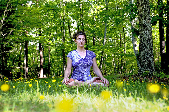 Young woman meditating. Image: WikiCommons