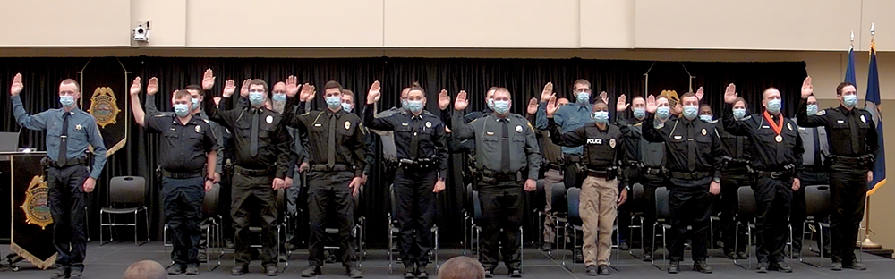 The 274th basic training class takes their oath during the graduation ceremony Feb. 26 in KLETC’s Integrity Auditorium.      