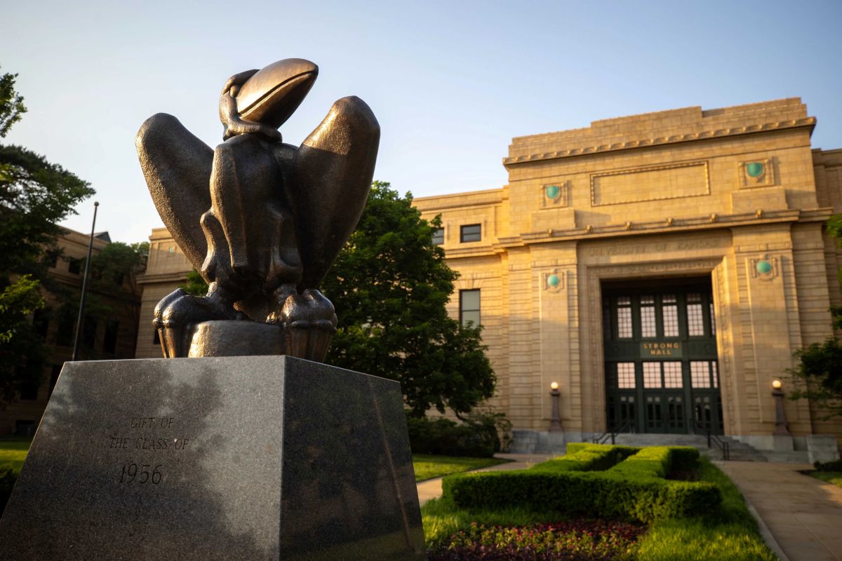 Bronze Jayhawk statue in front of Strong Hall on the University of Kansas Lawrence campus.