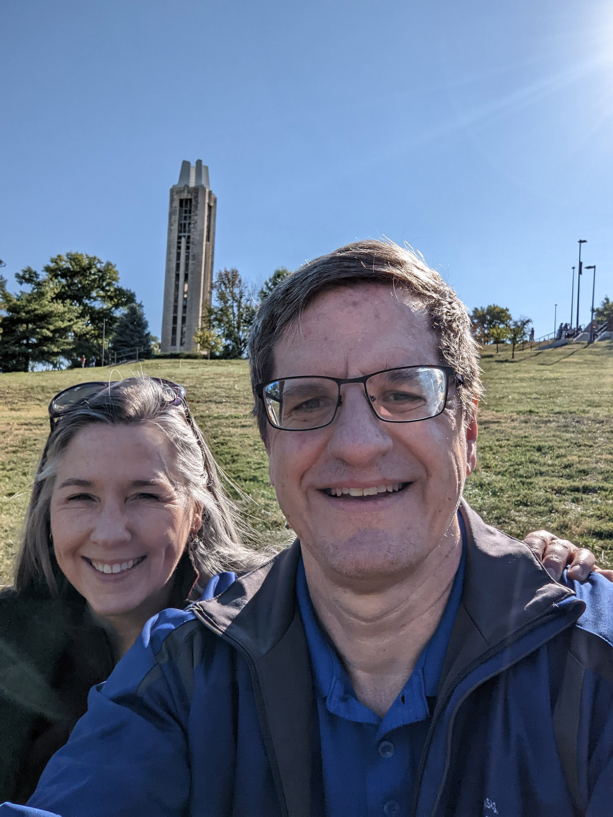 Beth Ellyn and Brian McClendon pictured on the Lawrence campus with the Campanile in the distant background.