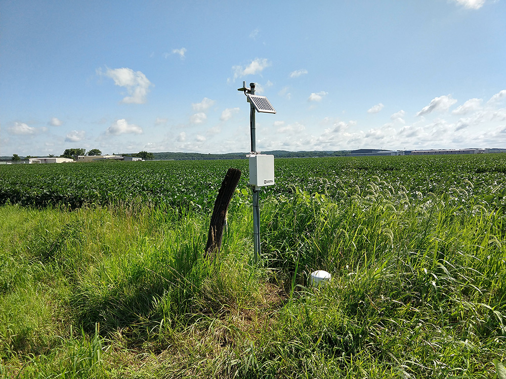 A KGS Kansas River alluvial aquifer groundwater monitoring well near an agricultural field.