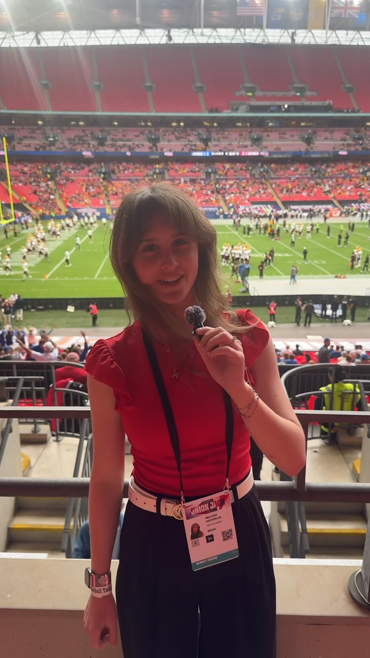 Melaina Hesterlee reports during pre-game warm-ups at Wembley Stadium
