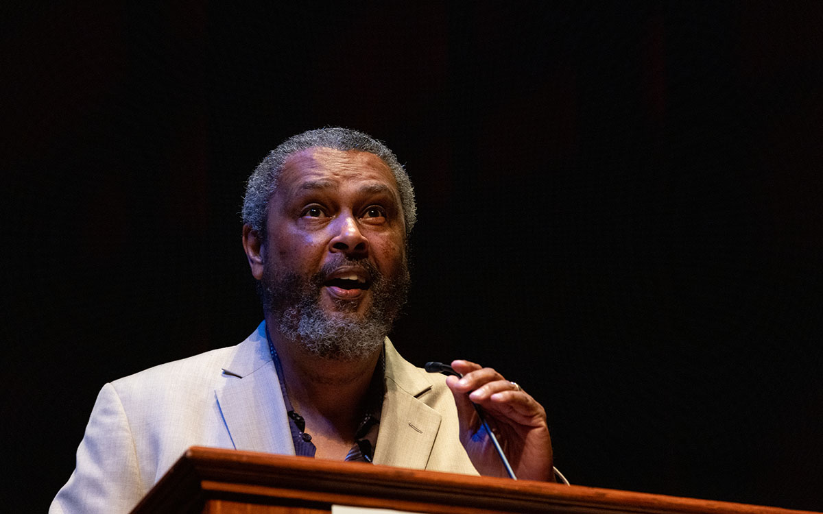 Kevin Willmott speaking at a podium.