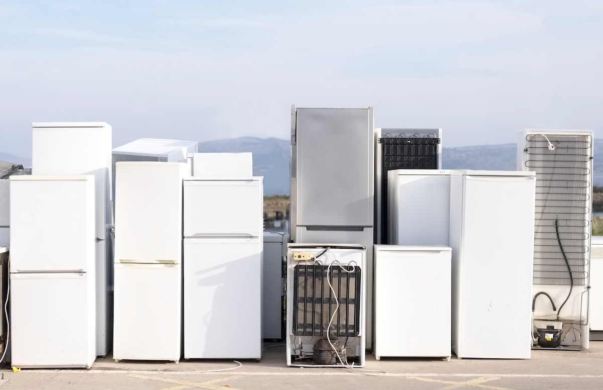 Photo of refrigerators at a recycling facility.