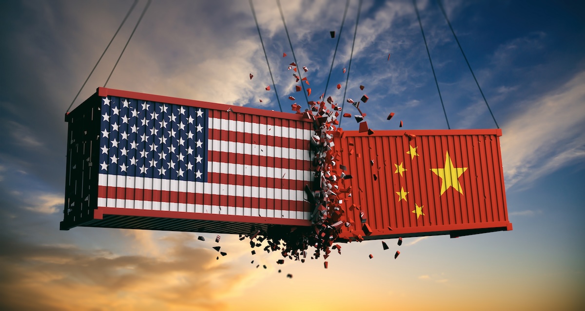 A photo illustration shows a cargo container painted with a U.S. flag crashing into one painted with a Chinese flag.