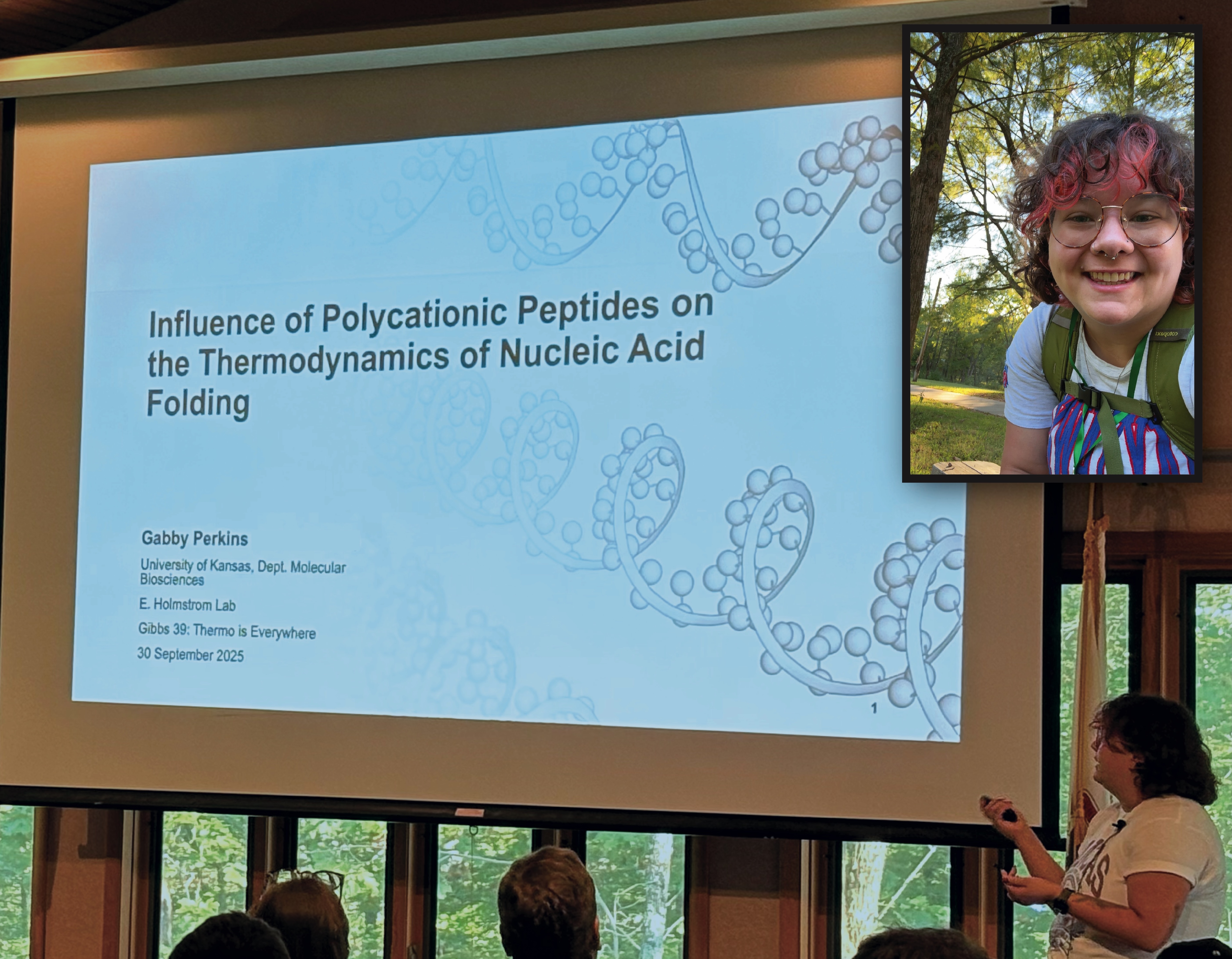 Gabby Perkins presents her research in front of a crowd