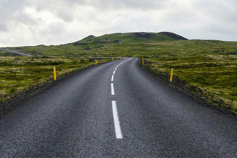 Road leading to green hills