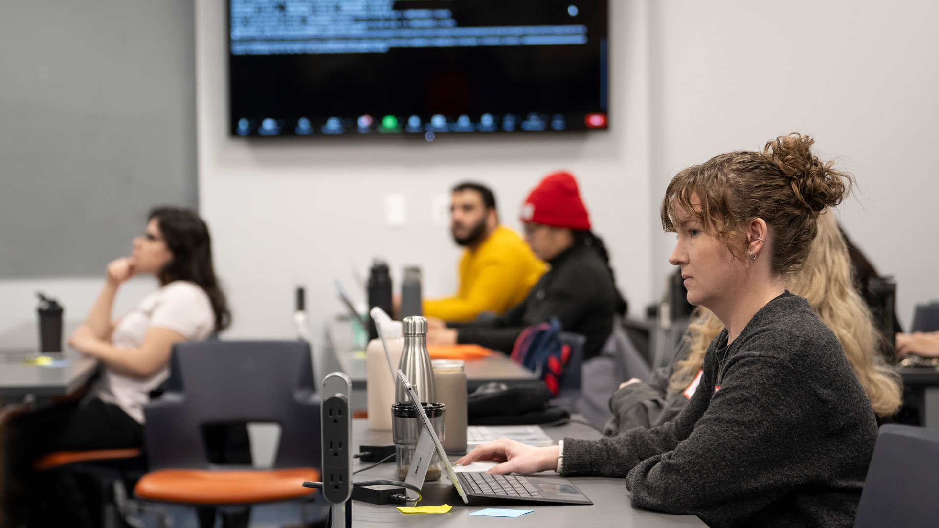 Students sit at tables during the Data Carpentry Genomics Workshop.