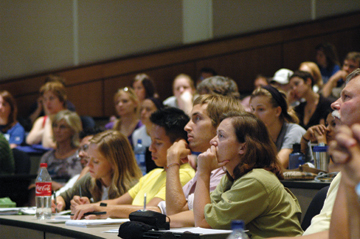 Students at the University of Kansas take in Hansen’s message.