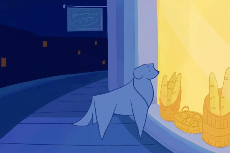A still from an animated short shows a stylized blue dog standing on a sidewalk at night, looking into a brightly lit bakery window. Inside the window, baskets of golden baguettes glow in warm yellow light, contrasting with the cool blue tones of the street and buildings outside.