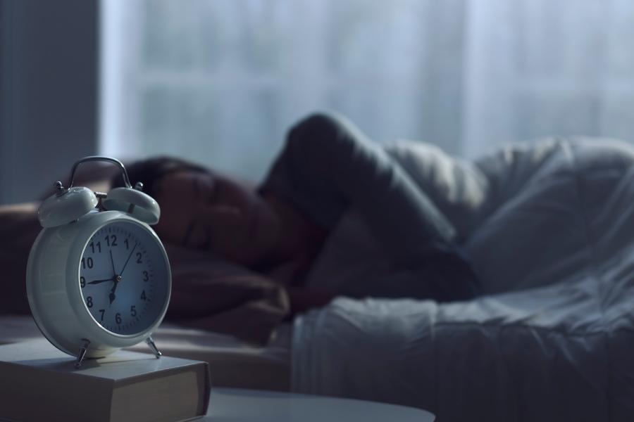 Stock photo of woman sleeping in bed.