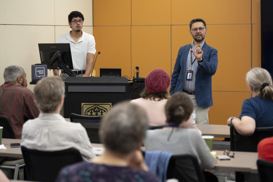 Milton Machuca-Gálvez and Miguel Ángel Castro Cano give a presentation in Watson Library's 455 Conference Room on Wednesday.