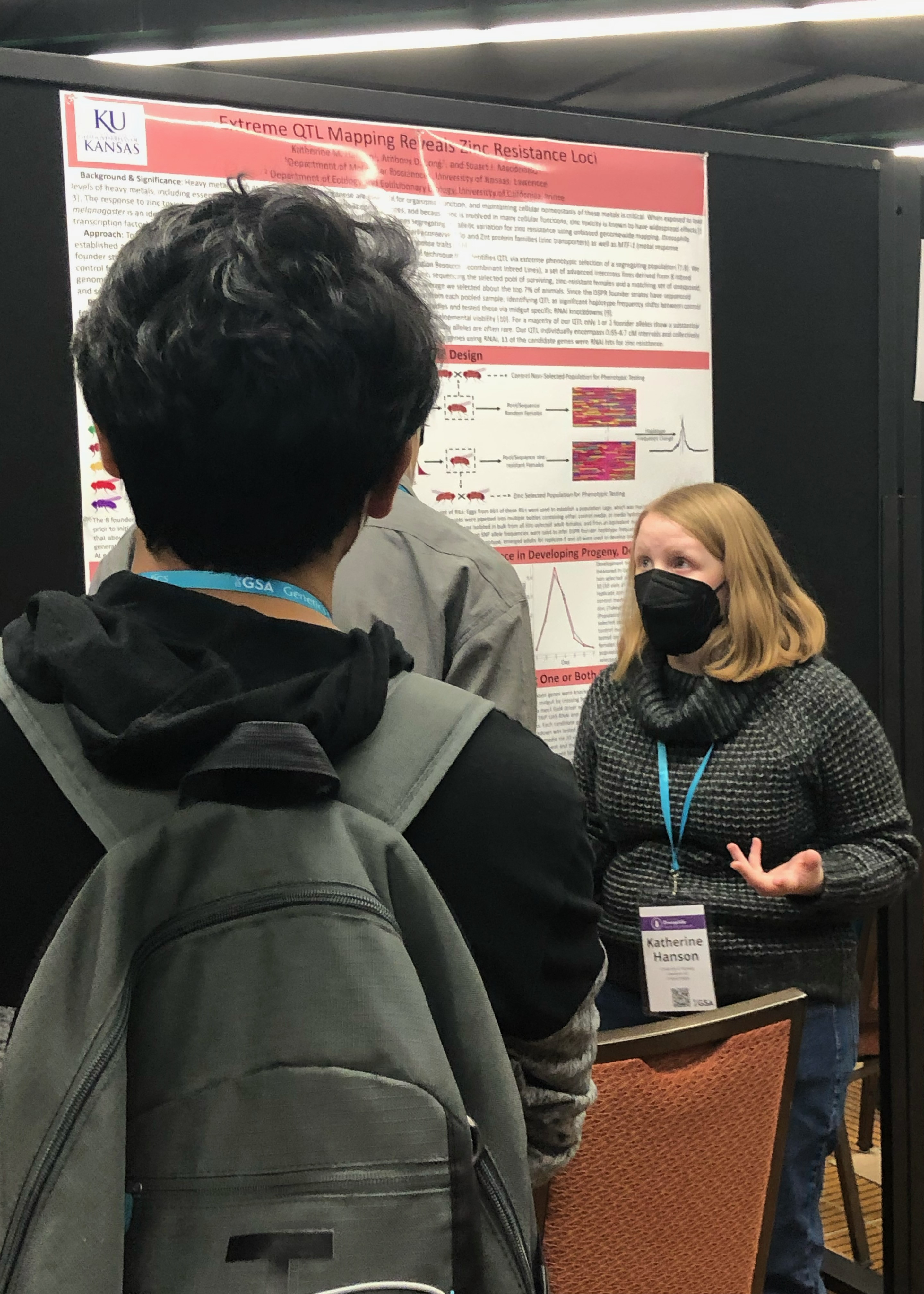 Katherine Hanson explains poster to a group