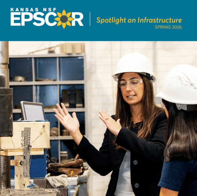 Engineers in lab wearing hard hats