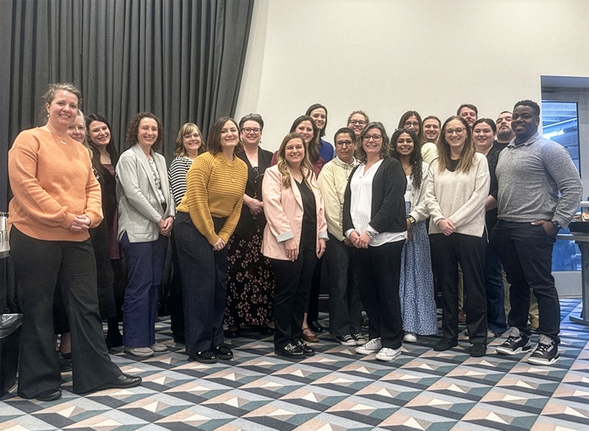 Group photo of Cohort 5 in a conference room