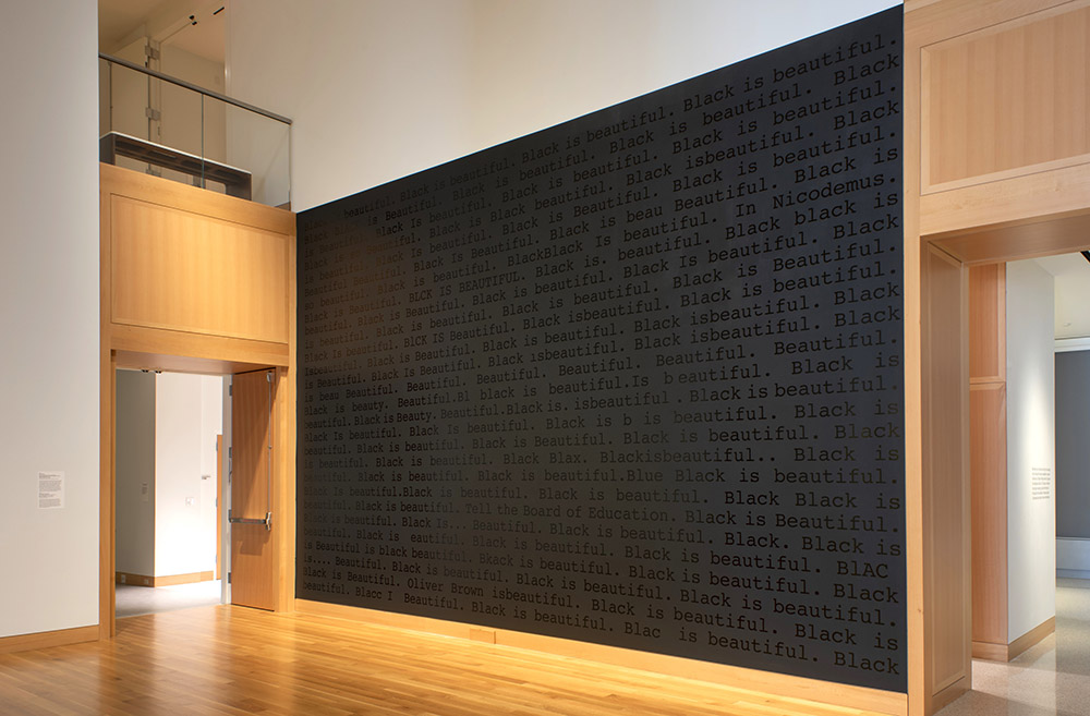 Two murals titled “Black is Beautiful” by artist Paul Stephen Benjamin are featured at the Spencer Museum of Art’s “Black Writing” exhibition. Photo by Ryan Waggoner.